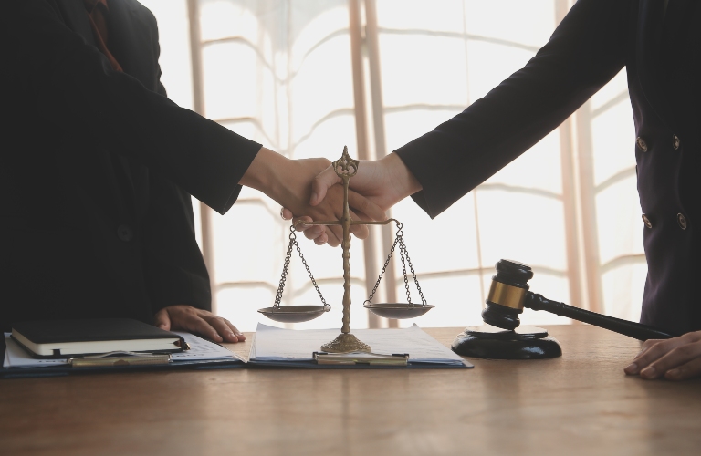 Lawyer shaking hands with a client